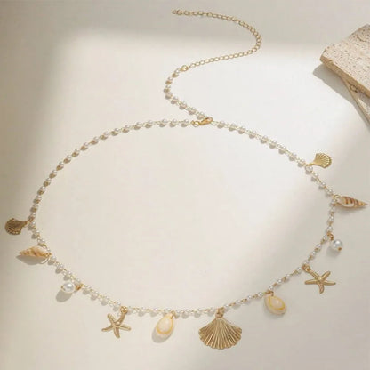 Chaîne de taille bohème d'été, pendentif en forme d'étoile de mer, coquillage, lien de taille ajouré, chaîne de corps pour bikini de plage pour femmes