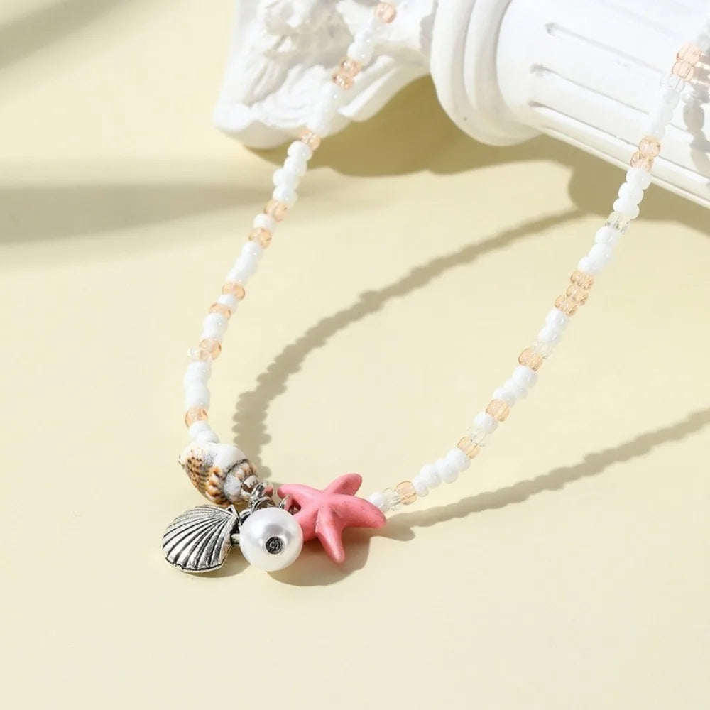 Chaîne de taille bohème d'été, pendentif en forme d'étoile de mer, coquillage, lien de taille ajouré, chaîne de corps pour bikini de plage pour femmes