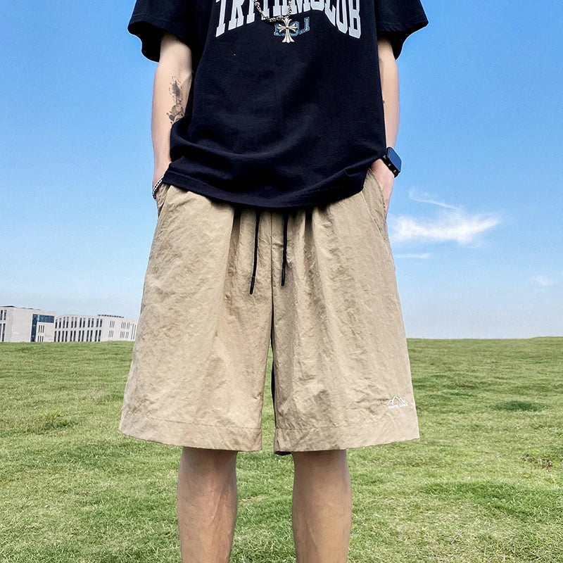 Pantalons courts pour hommes, pantalons décontractés d'été, pantalons à cordon de serrage, salopettes coréennes simples et polyvalentes, pantalons amples tendance pour hommes